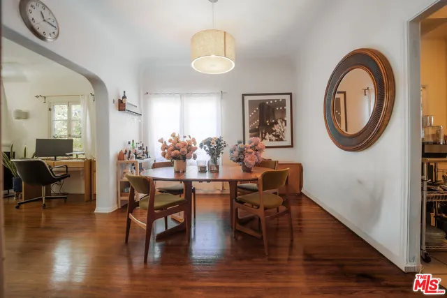 a view of a dining room with furniture and wooden floor