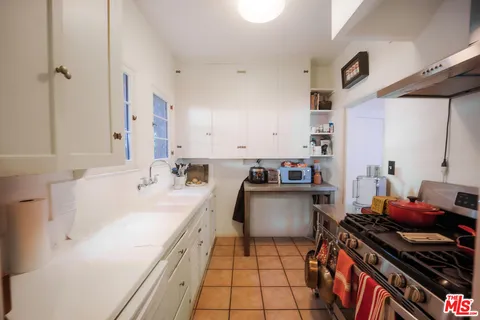 a kitchen with a stove and a sink