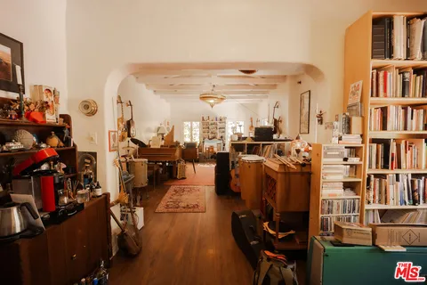 a view of a living room with furniture and toys