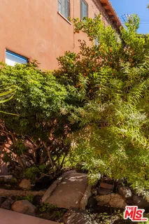 a view of a street with a building in the background