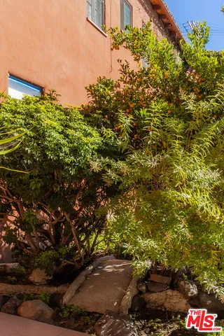 a view of a street with a building in the background
