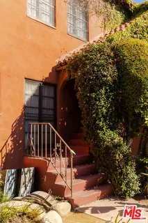 a view of balcony with furniture