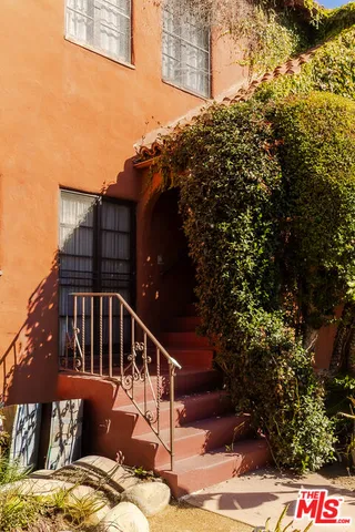a view of balcony with furniture