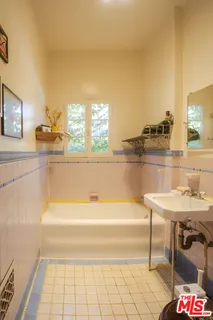 a bathroom with a bathtub and a sink