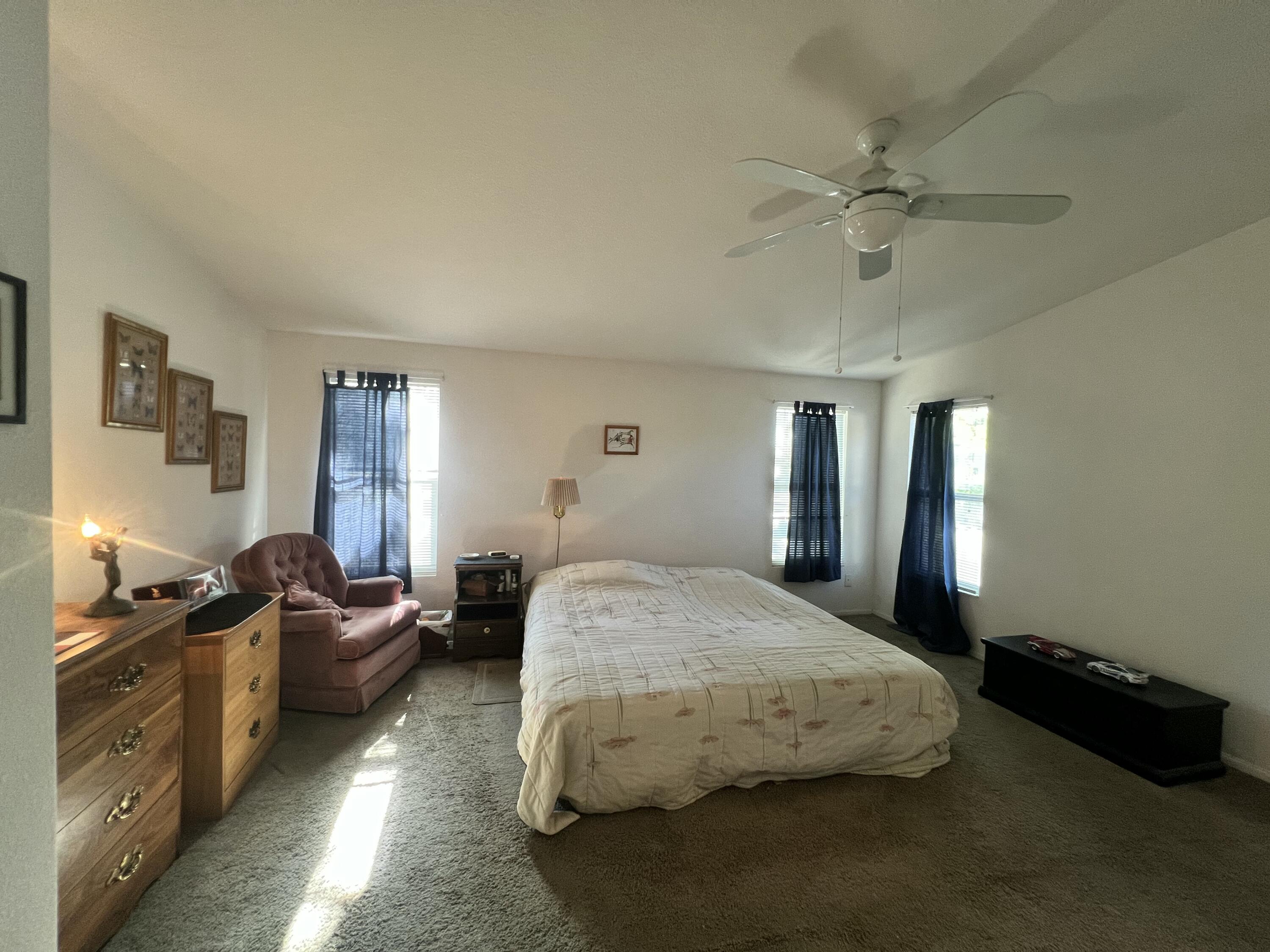 4722 Maple Trail Redding, CA 96003 - Photo 12 of 14 a spacious bedroom with a bed and furniture