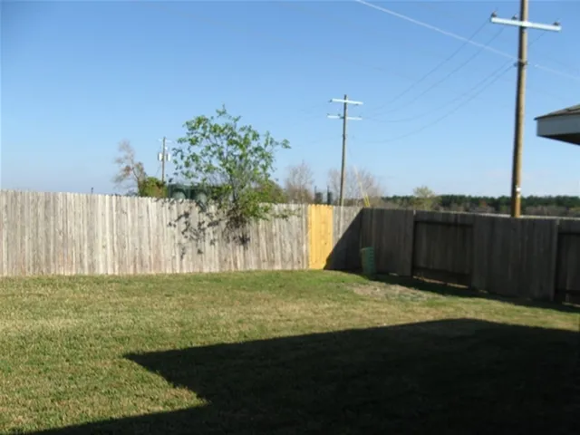 a view of a field with an ocean view
