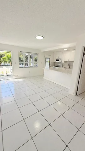 a view of kitchen with furniture and cabinets
