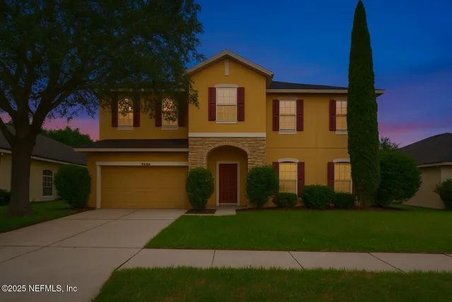 a bedroom with a bed and a table