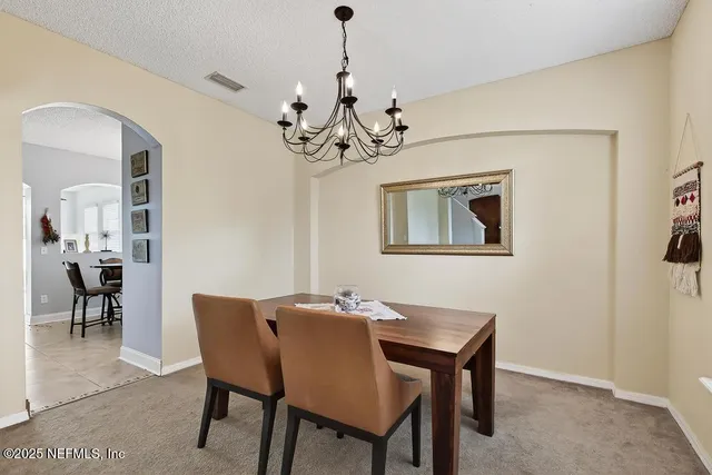 an aerial view of residential houses with outdoor space and river