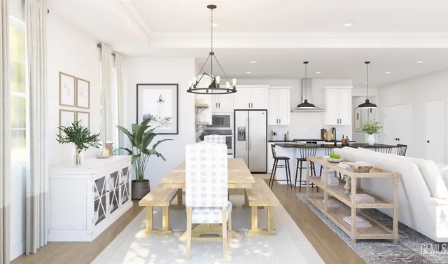 a view of a kitchen with furniture and wooden floor