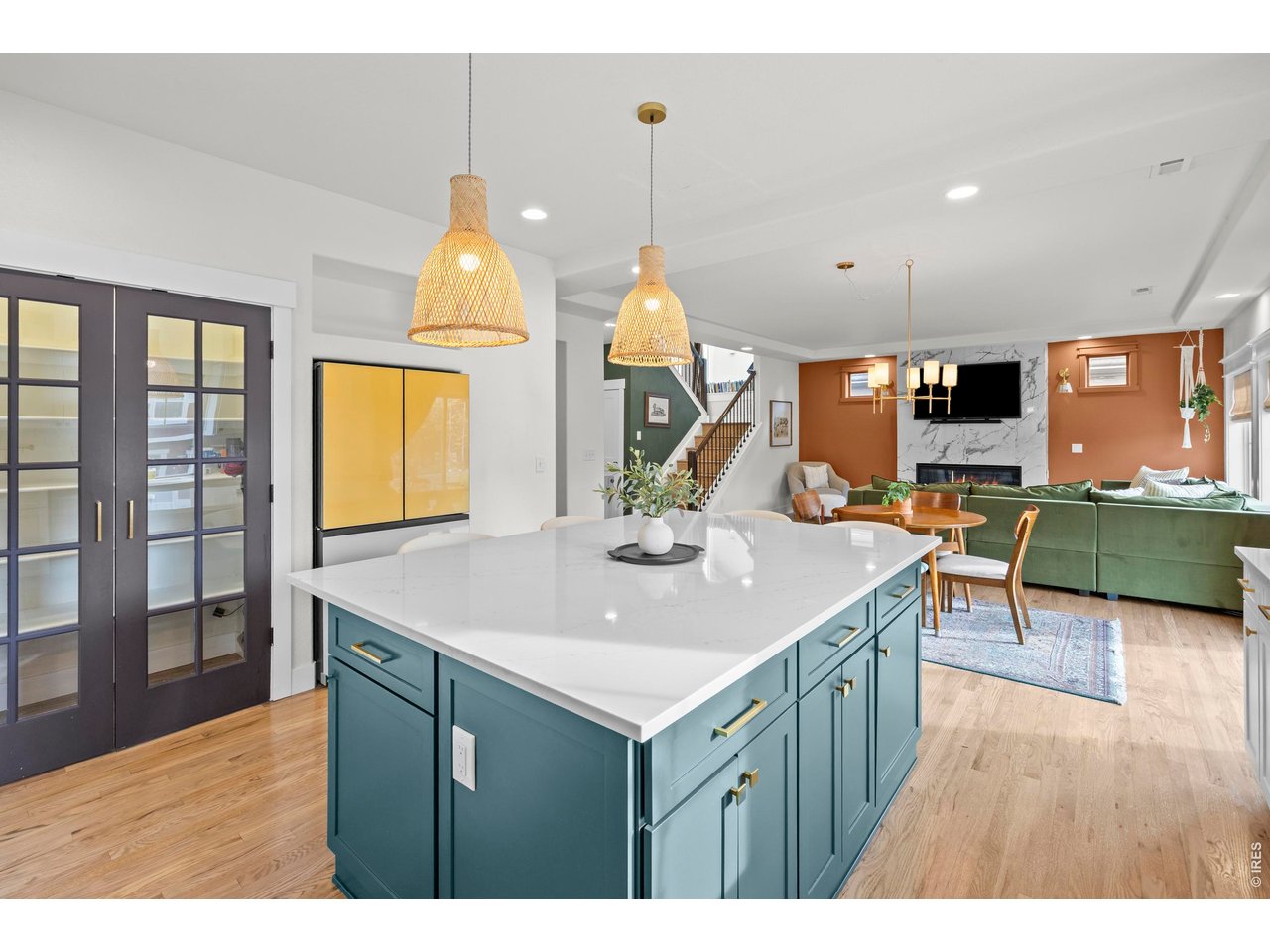 148 Summit Way Erie, CO 80516 - Photo 12 of 47 a kitchen that has a lot of cabinets a sink and a wooden floor in it