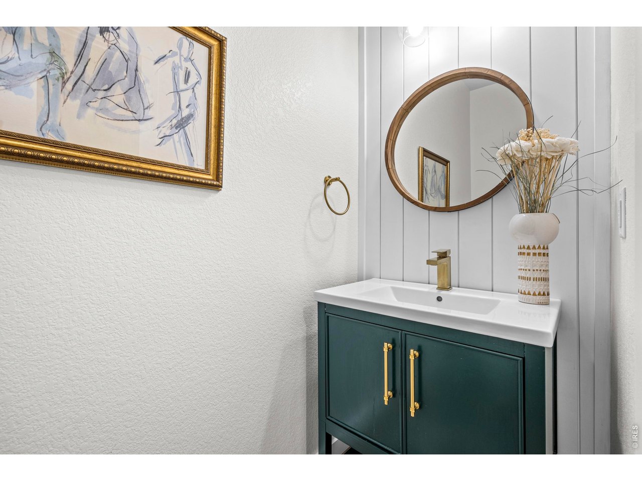 148 Summit Way Erie, CO 80516 - Photo 18 of 47 a bathroom with a sink and a mirror