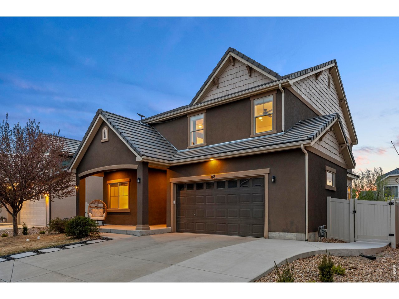 148 Summit Way Erie, CO 80516 - Photo 2 of 47 a front view of a house with a yard