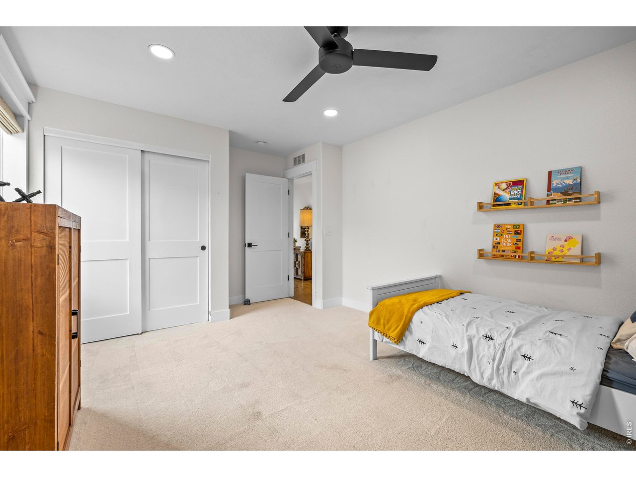 148 Summit Way Erie, CO 80516 - Photo 26 of 47 a bedroom with a bed and a painting on the wall