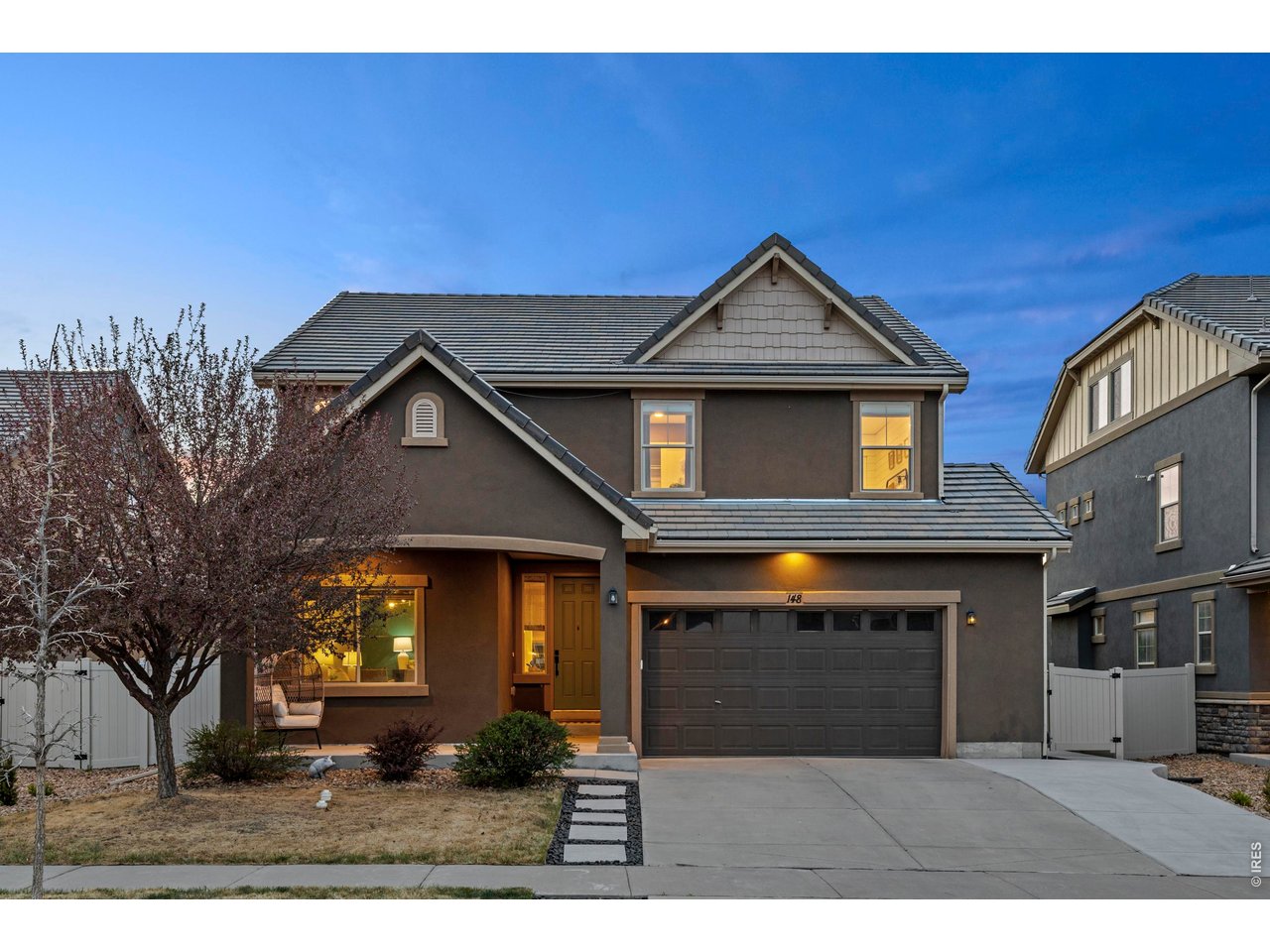 148 Summit Way Erie, CO 80516 - Photo 3 of 47 a view of a house with a yard and potted plants