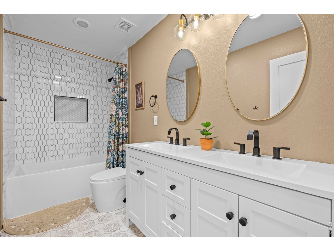 148 Summit Way Erie, CO 80516 - Photo 31 of 47 a bathroom with a toilet a sink a mirror and bathtub