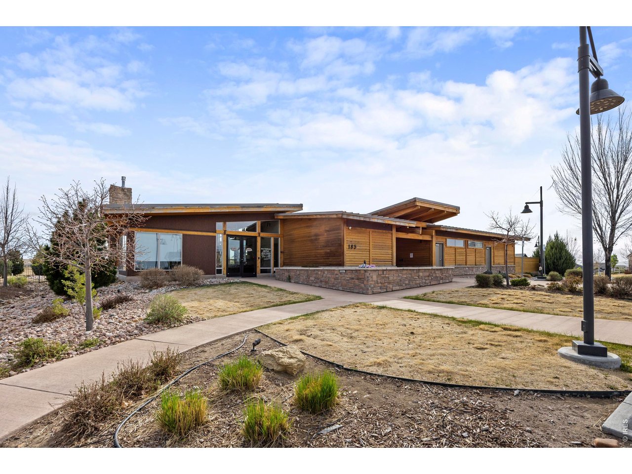 148 Summit Way Erie, CO 80516 - Photo 40 of 47 a front view of a house with a yard