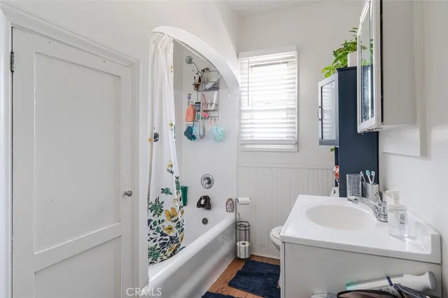 a bedroom with bed and window