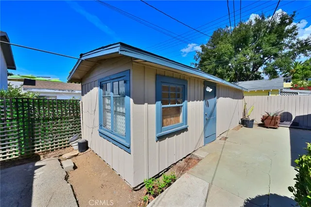a view of a house with a road