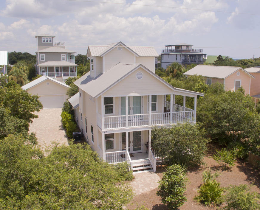 97 Sand Dunes Road Santa Rosa Beach, FL 32459 - Photo 1 of 31 a front view of a house with a yard and lake view