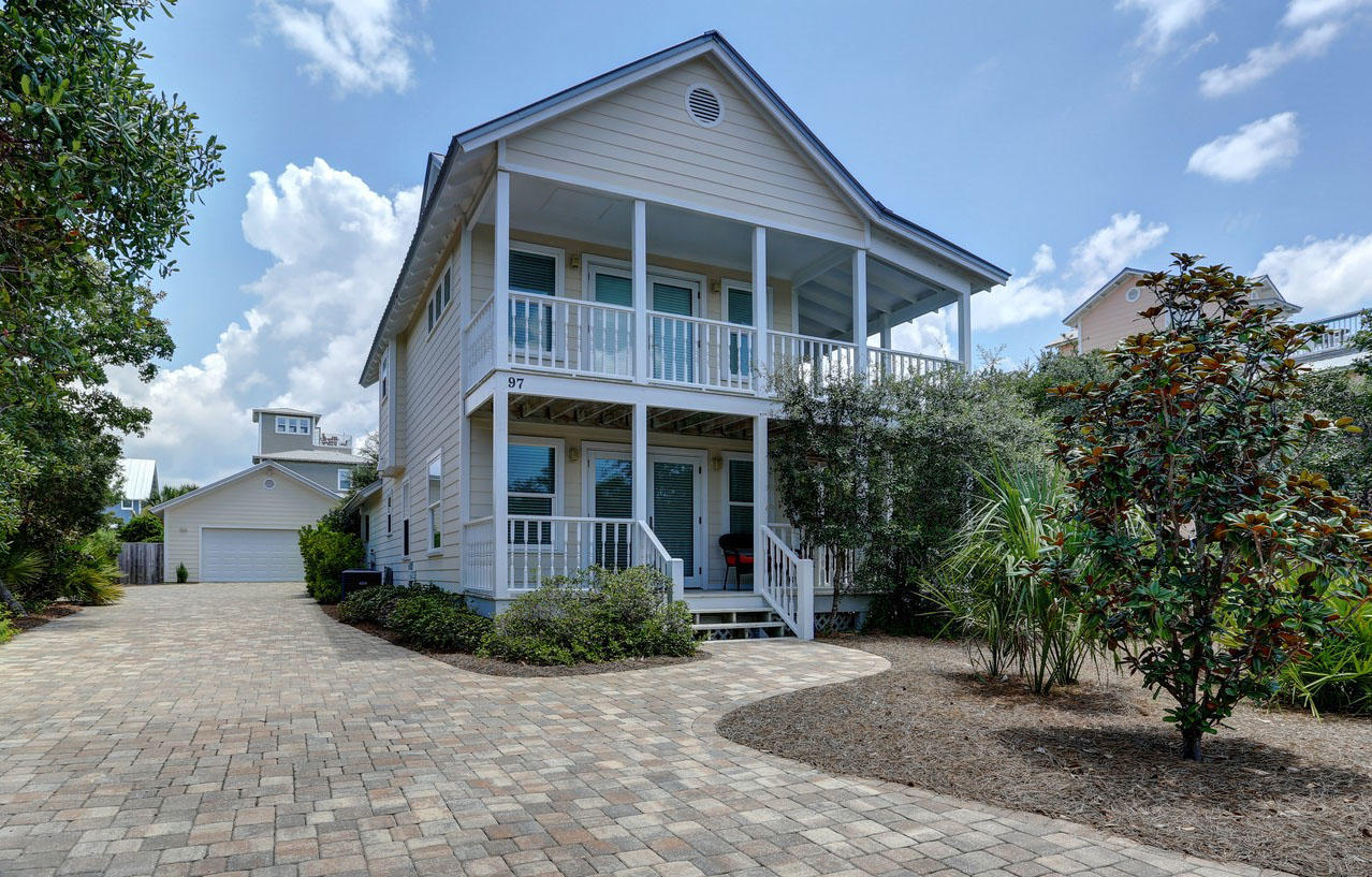 97 Sand Dunes Road Santa Rosa Beach, FL 32459 - Photo 2 of 31 a front view of a house with garden