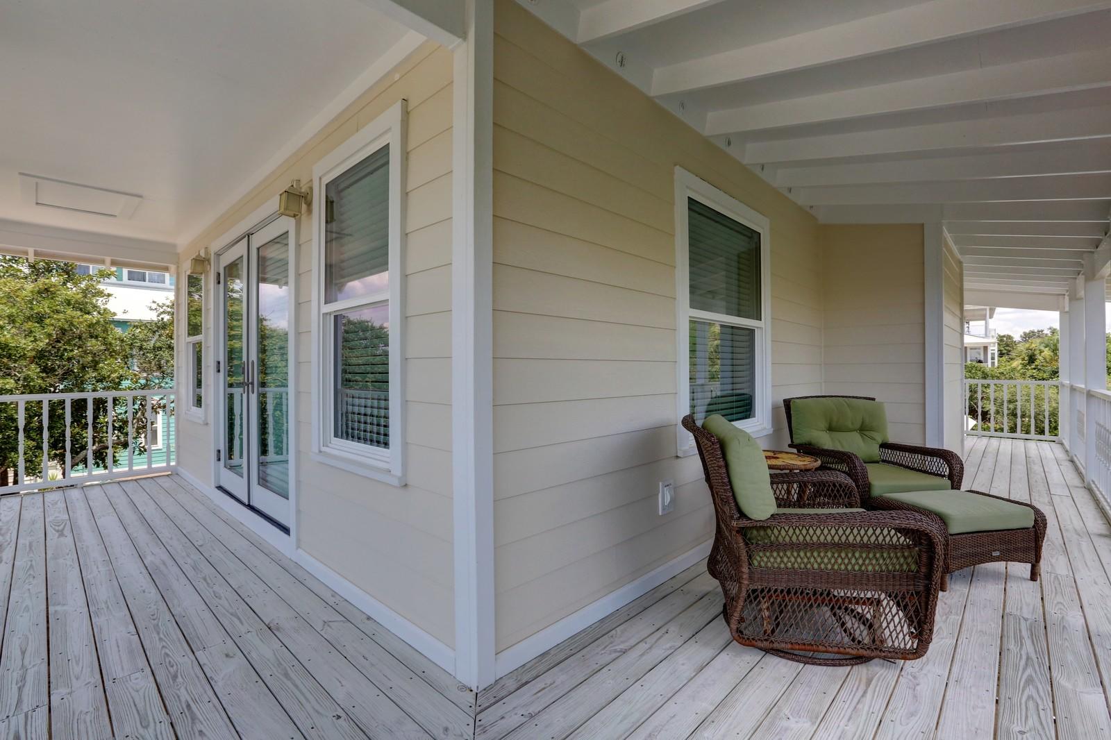 97 Sand Dunes Road Santa Rosa Beach, FL 32459 - Photo 23 of 31 a wooden bench sitting in front of a house