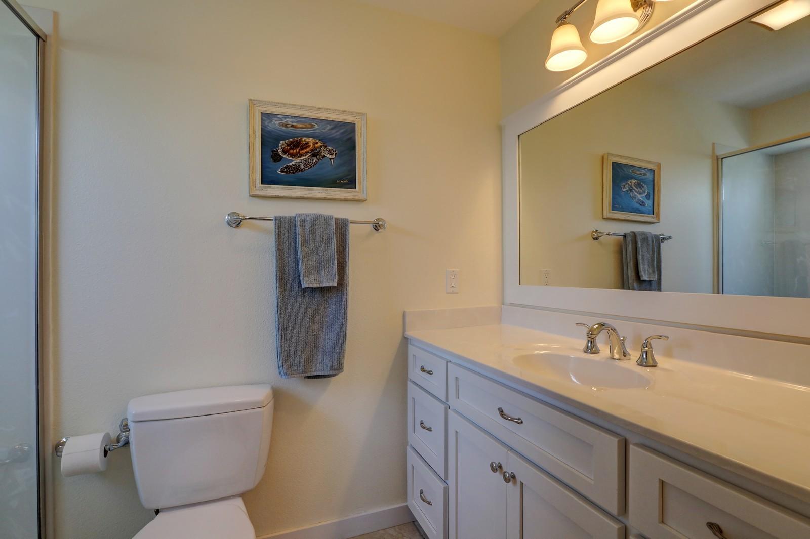97 Sand Dunes Road Santa Rosa Beach, FL 32459 - Photo 27 of 31 a bathroom with a granite countertop toilet sink and mirror