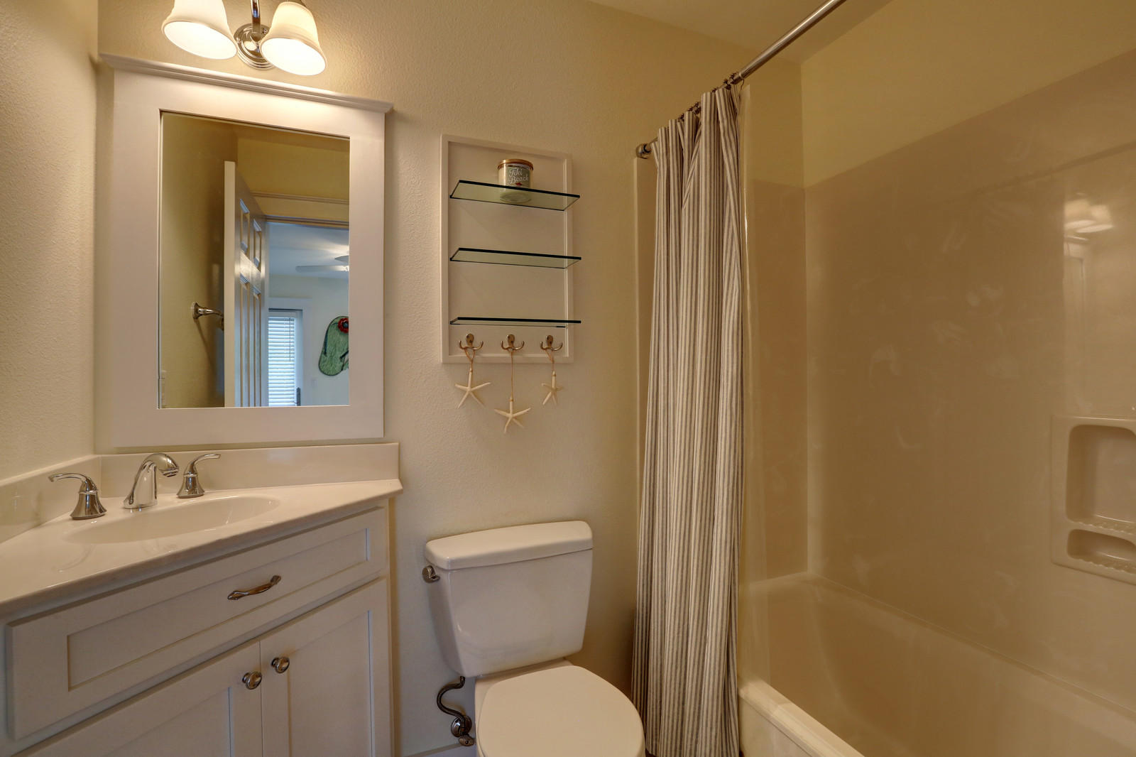 97 Sand Dunes Road Santa Rosa Beach, FL 32459 - Photo 30 of 31 a bathroom with a granite countertop sink toilet and shower