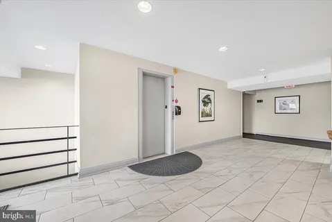 a view of a livingroom with furniture and a flat screen tv