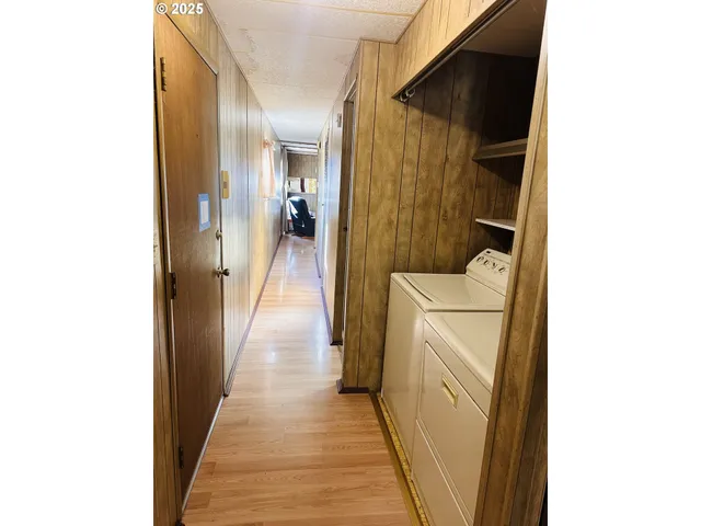 a hallway with washer and dryer