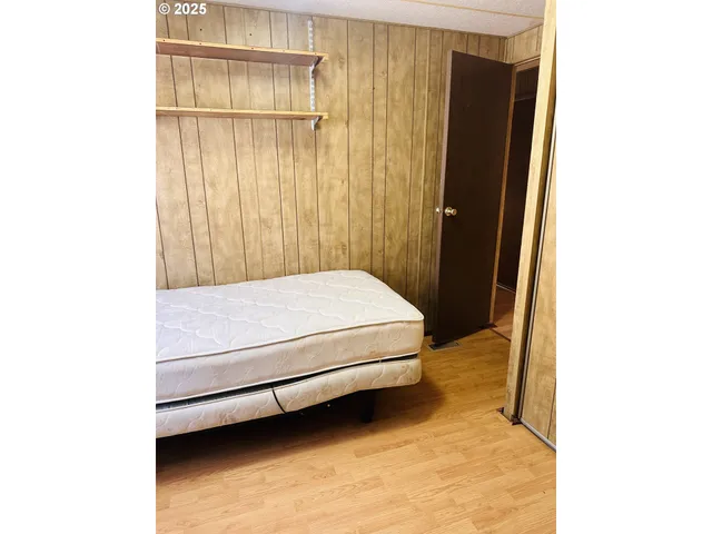 a bedroom with a bed and a cabinets