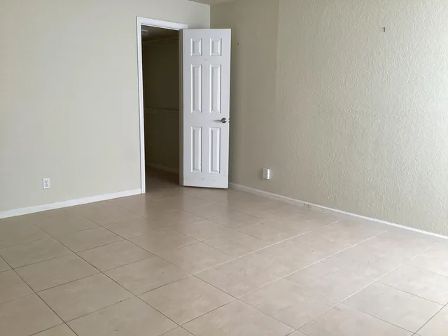a bathroom with a toilet and a bath tub