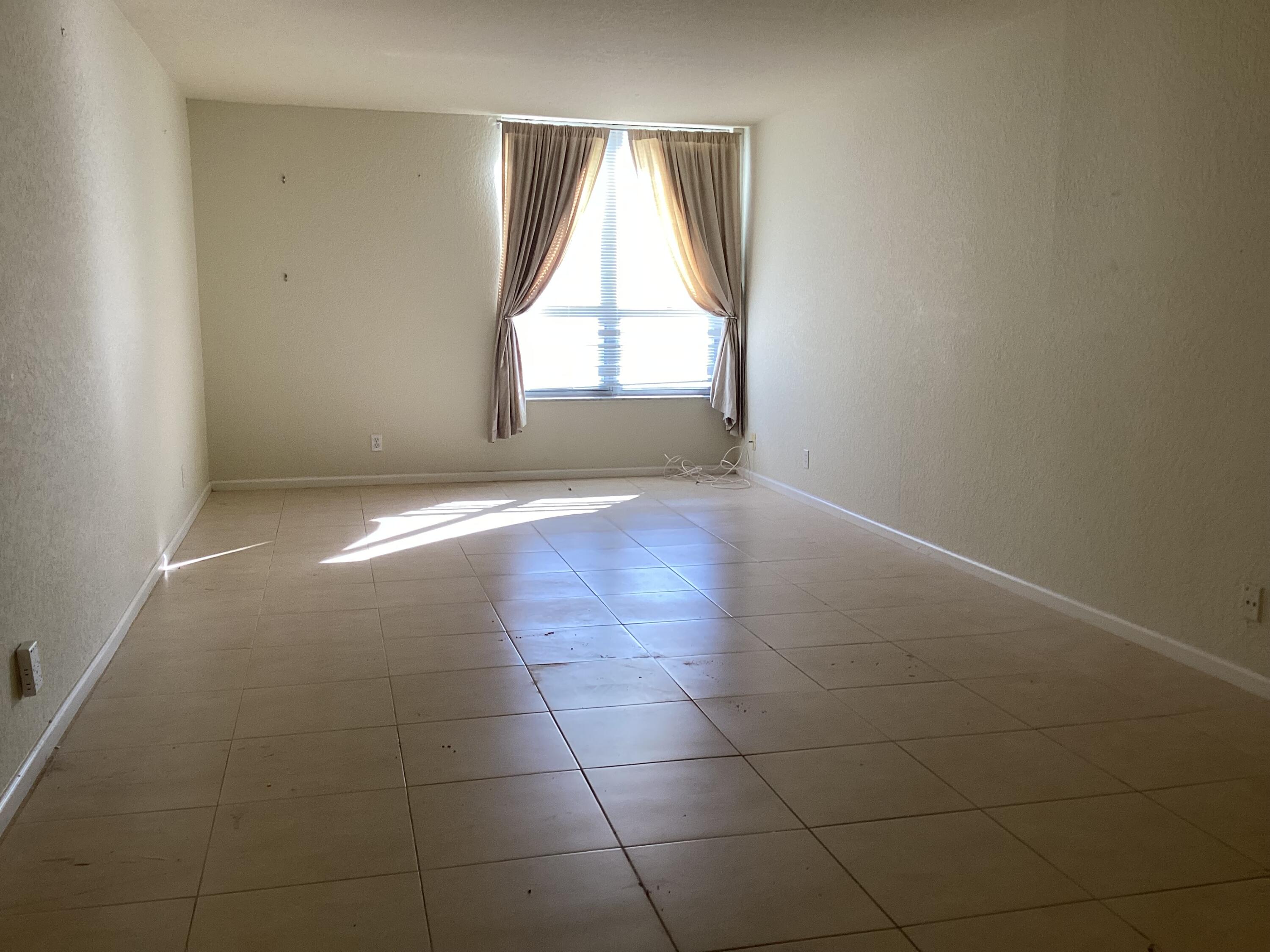 1000 Spanish River Road, Unit 3K Boca Raton, FL 33432 - Photo 15 of 32 an empty room with windows