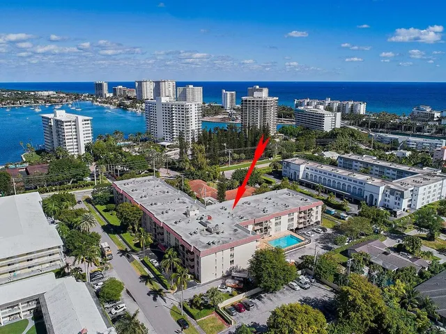 a living room with fireplace furniture and a chandelier