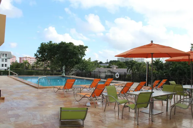 a balcony with view of car parked