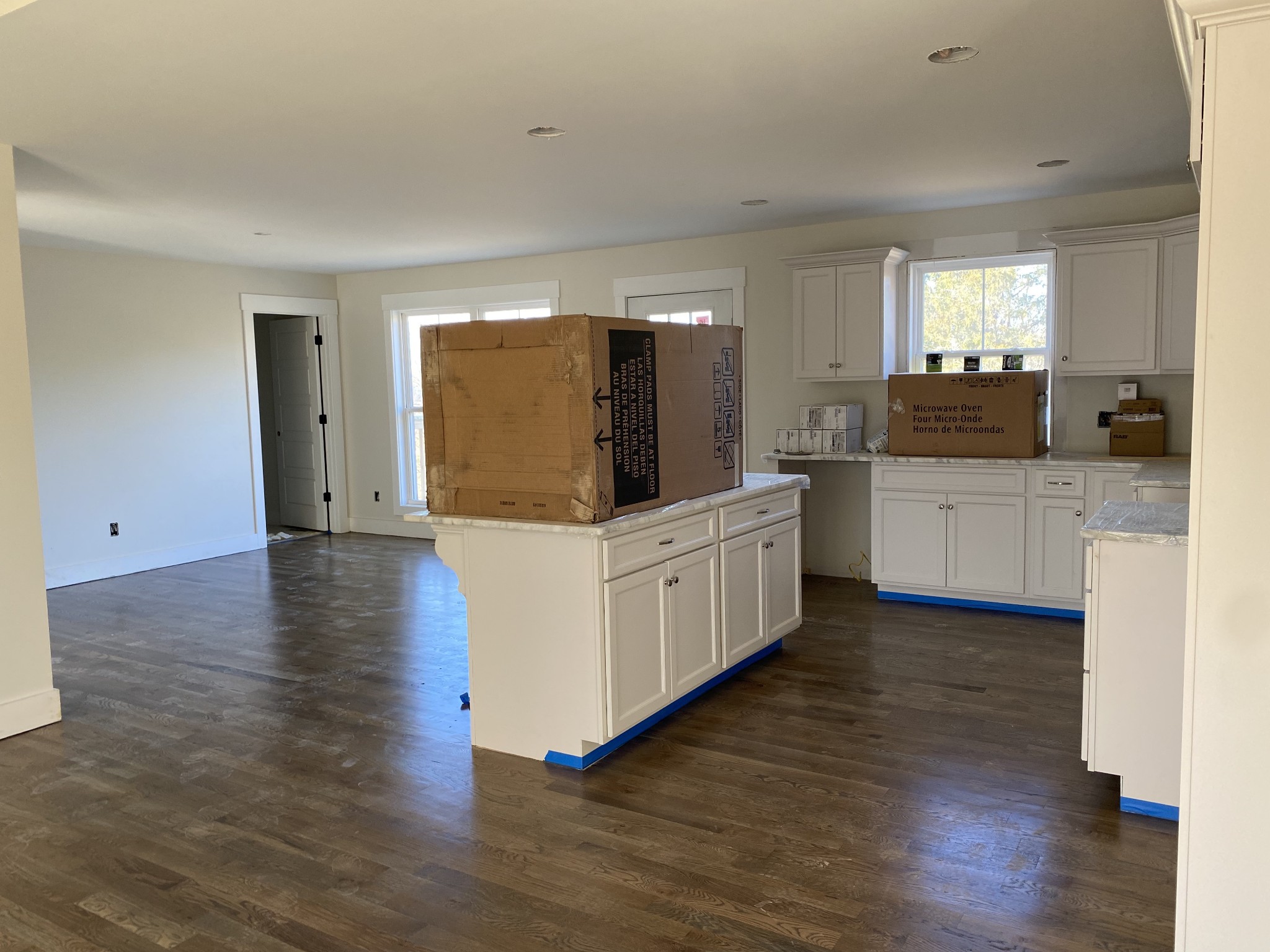 1011 North Corinth Road Portland, TN 37148 - Photo 5 of 5 a kitchen with stainless steel appliances a kitchen island hardwood floor sink and wooden floor