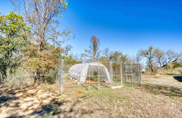a view of a yard with table and chairs