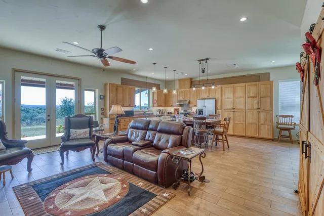 a living room with furniture and a large window