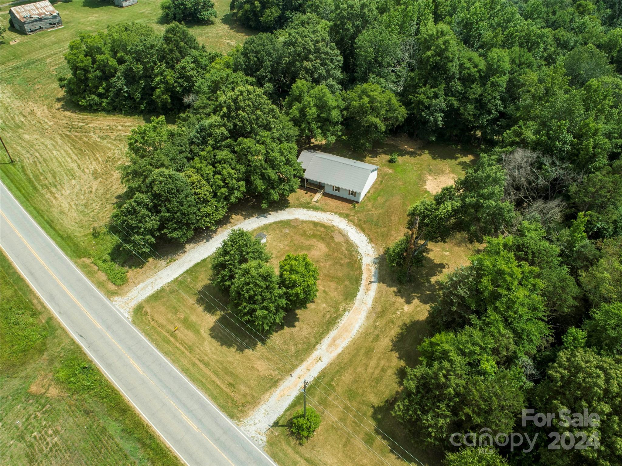 8225 Woodleaf Road Woodleaf, NC 27054 - Photo 35 of 40 a view of a yard with plants