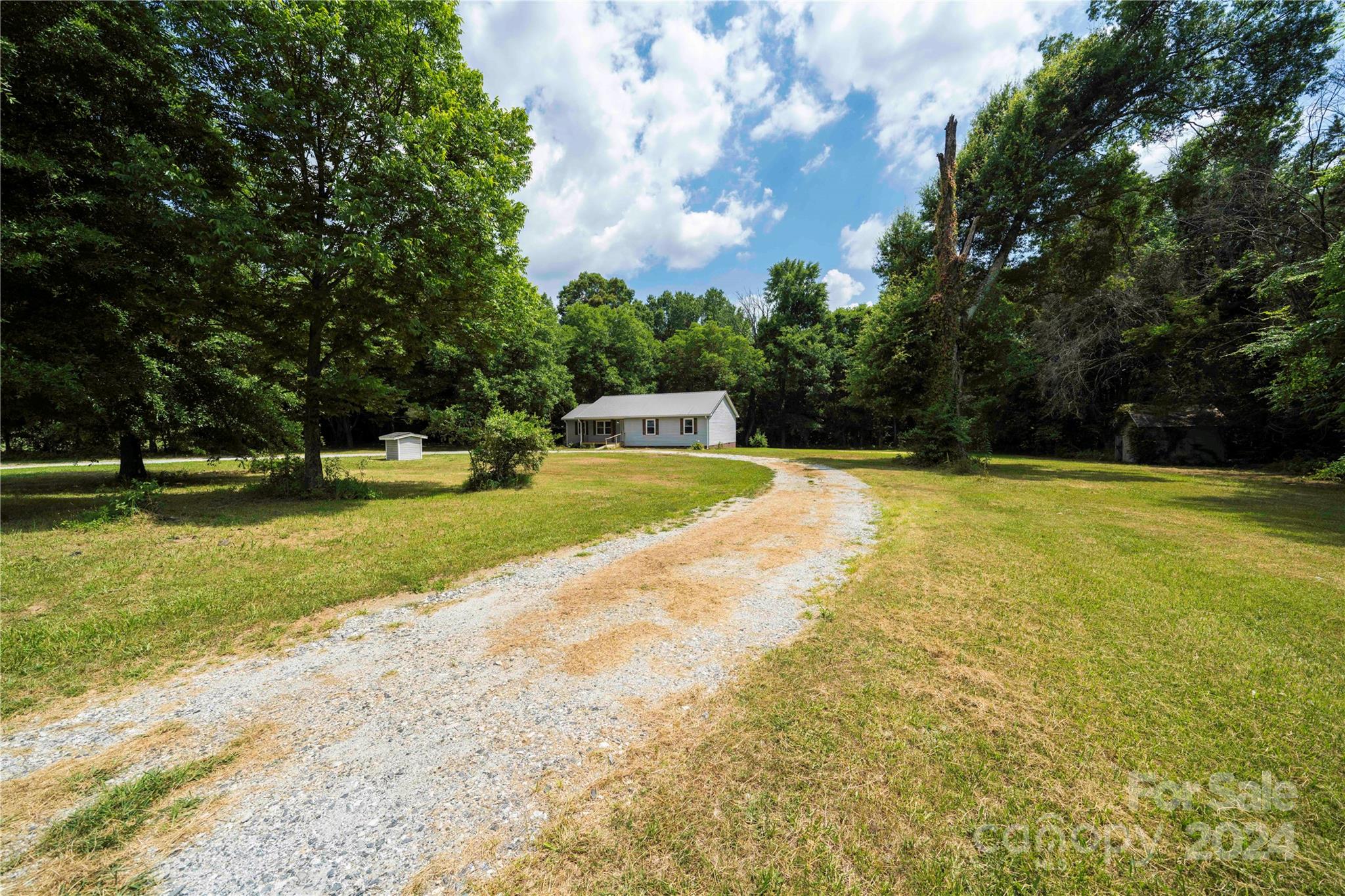 8225 Woodleaf Road Woodleaf, NC 27054 - Photo 5 of 40 a view of a swimming pool with a yard