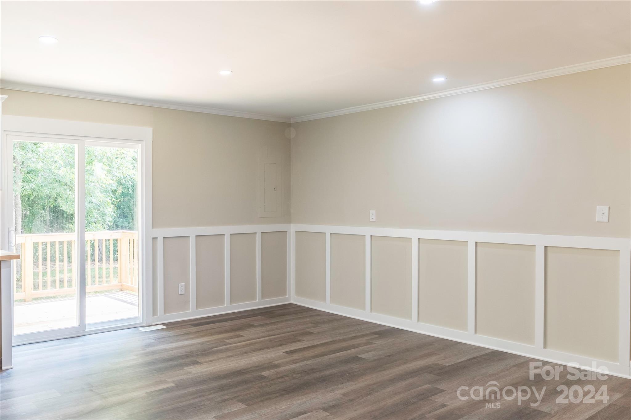 8225 Woodleaf Road Woodleaf, NC 27054 - Photo 10 of 40 a view of an empty room with wooden floor