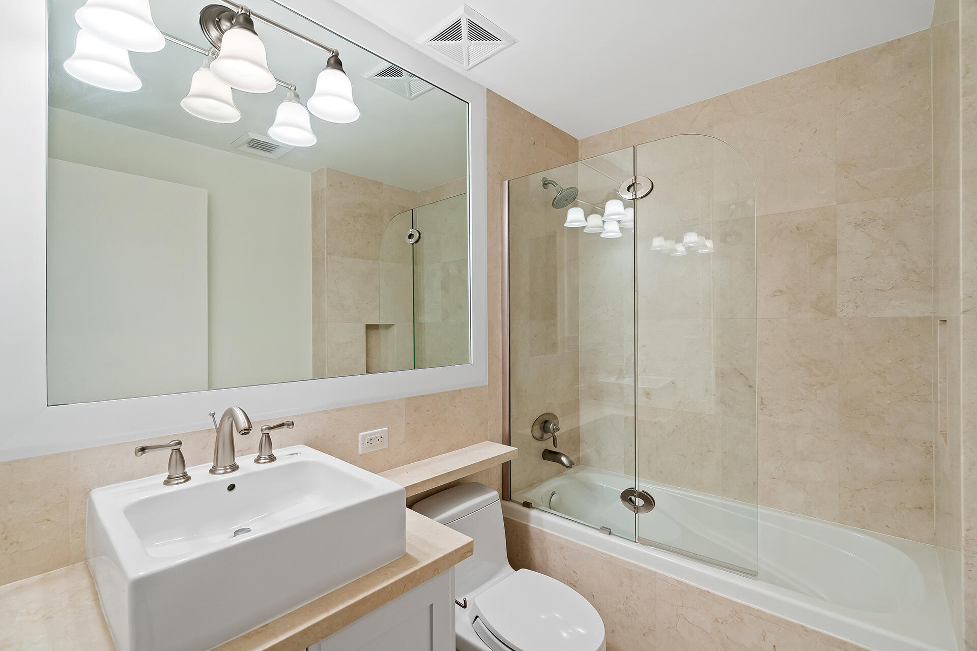 455 East Palmetto Park Road, Unit 3W Boca Raton, FL 33432 - Photo 14 of 40 a bathroom with a bathtub shower sink vanity and toilet