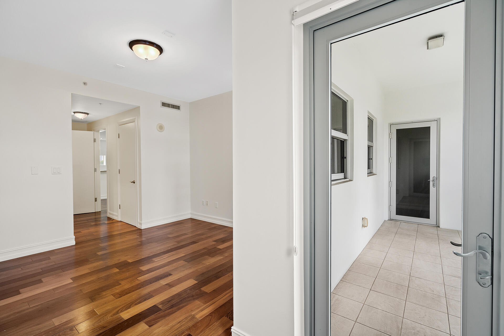 455 East Palmetto Park Road, Unit 3W Boca Raton, FL 33432 - Photo 15 of 40 a view of a hallway with wooden floor