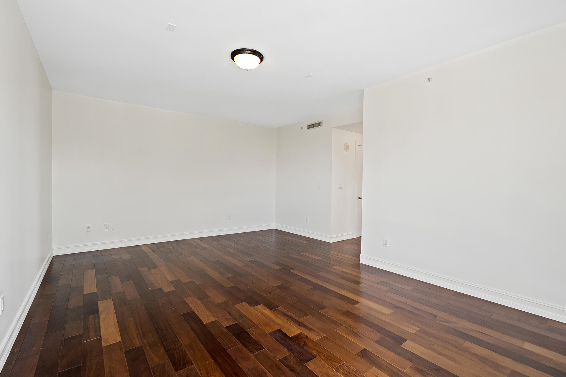 455 East Palmetto Park Road, Unit 3W Boca Raton, FL 33432 - Photo 25 of 40 a view of an empty room with wooden floor