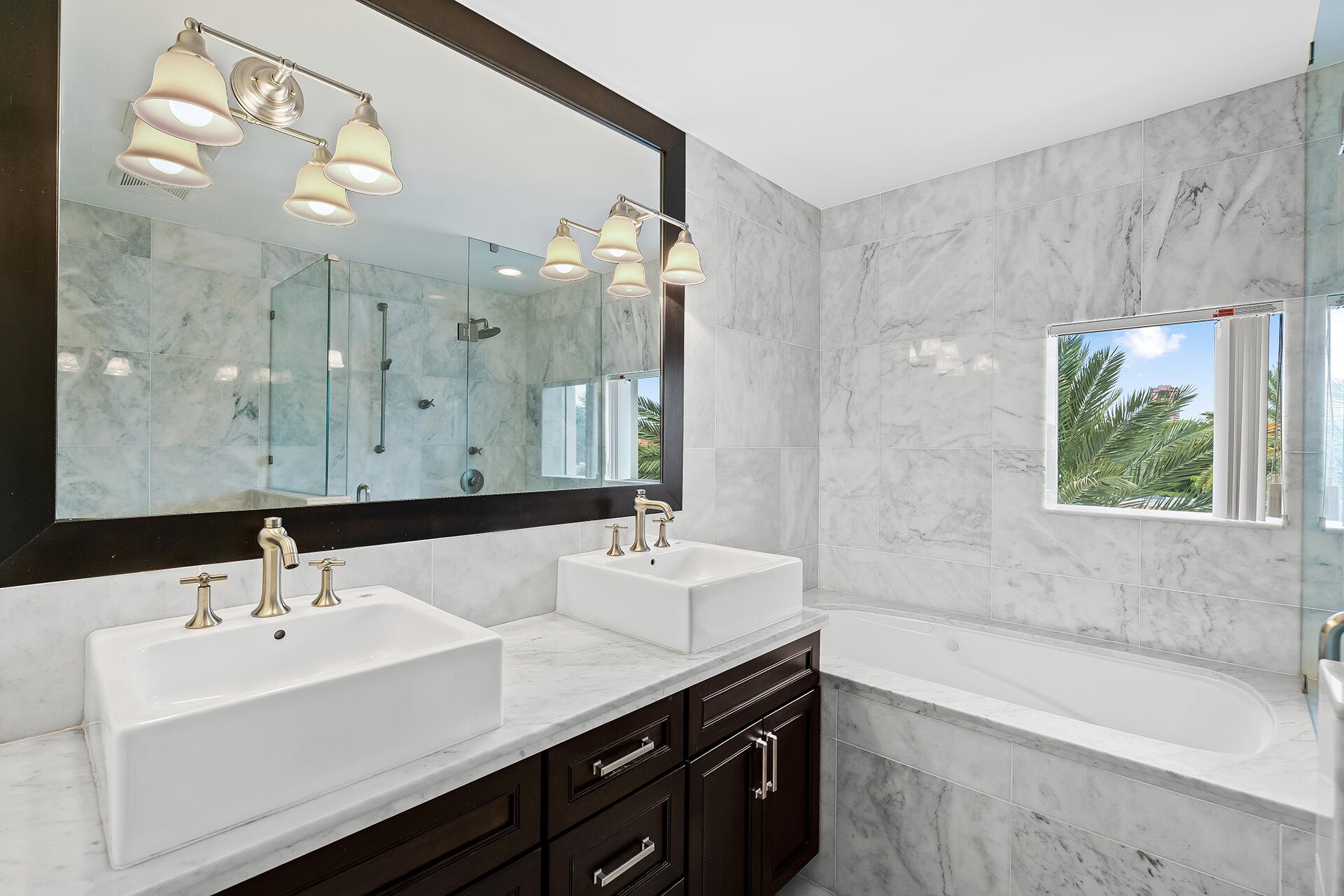 455 East Palmetto Park Road, Unit 3W Boca Raton, FL 33432 - Photo 26 of 40 a bathroom with a double vanity sink mirror and bathtub