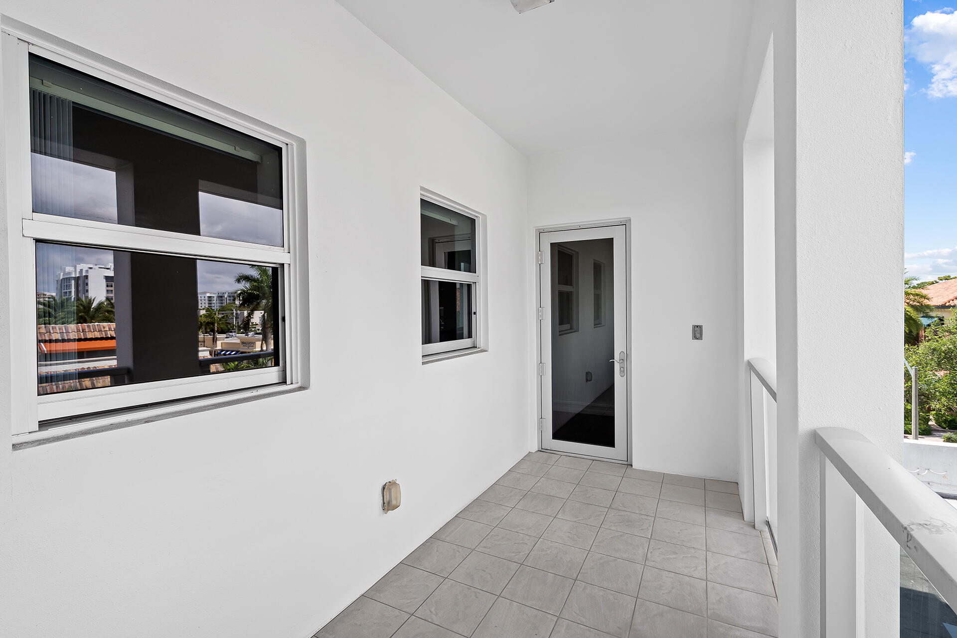455 East Palmetto Park Road, Unit 3W Boca Raton, FL 33432 - Photo 32 of 40 a view of a hallway that has front door