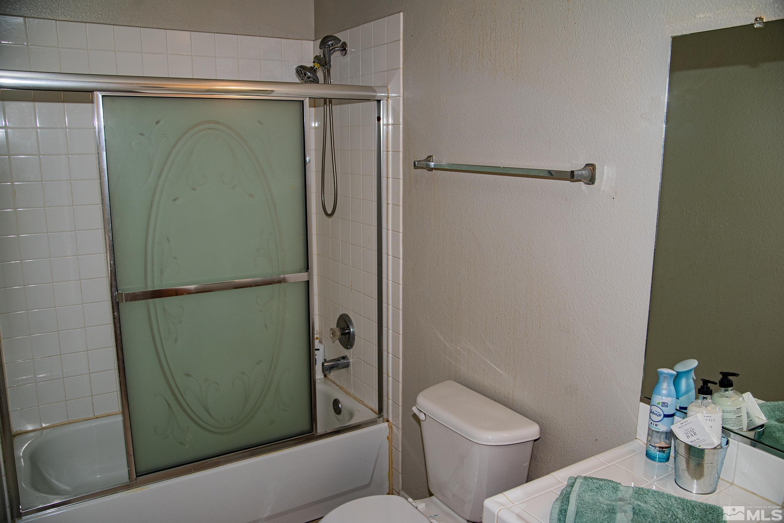 2525 Ridgecrest Drive Carson City, NV 89706 - Photo 11 of 21 a bathroom with a toilet and a shower