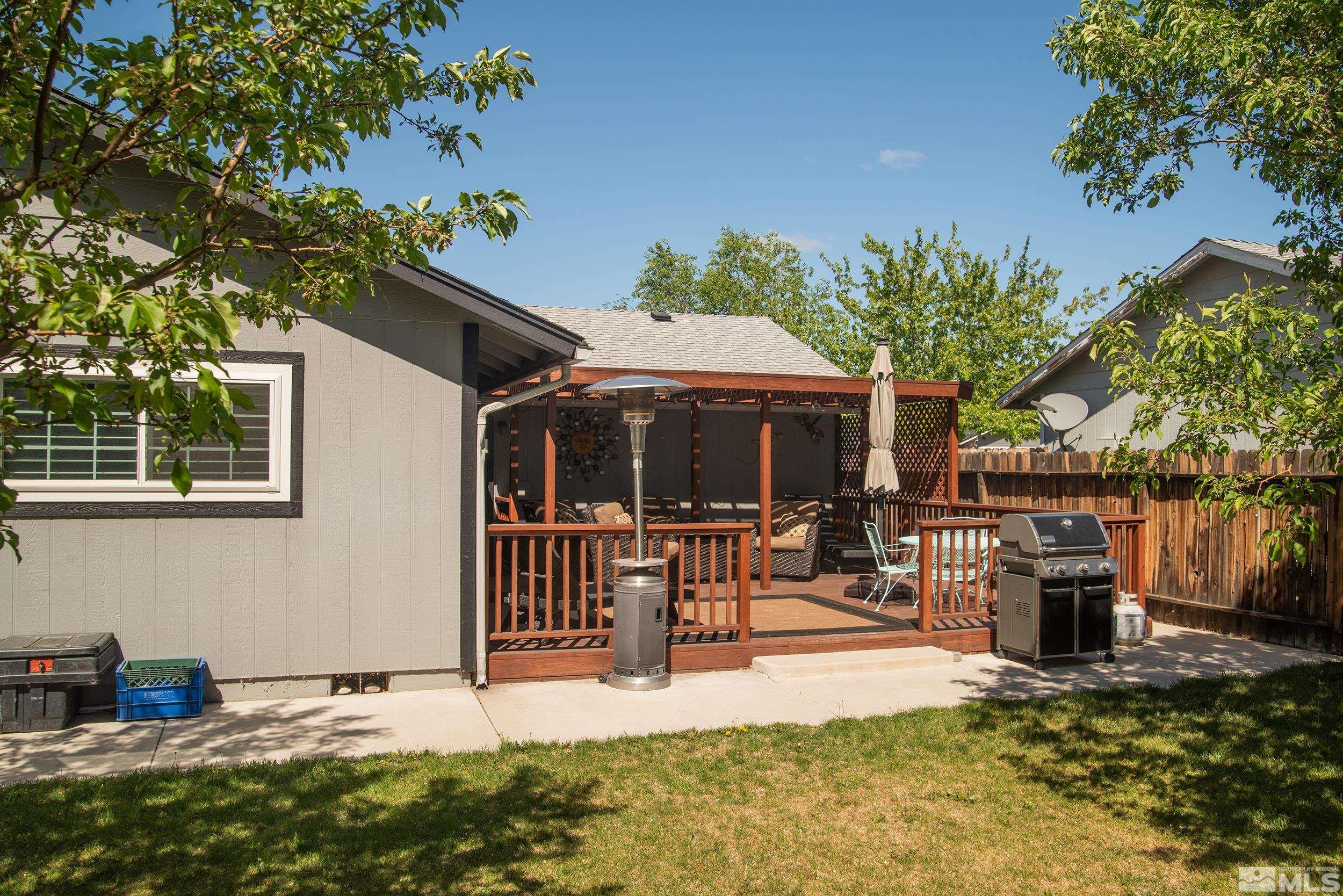 2525 Ridgecrest Drive Carson City, NV 89706 - Photo 15 of 21 a house with lots of trees in the background