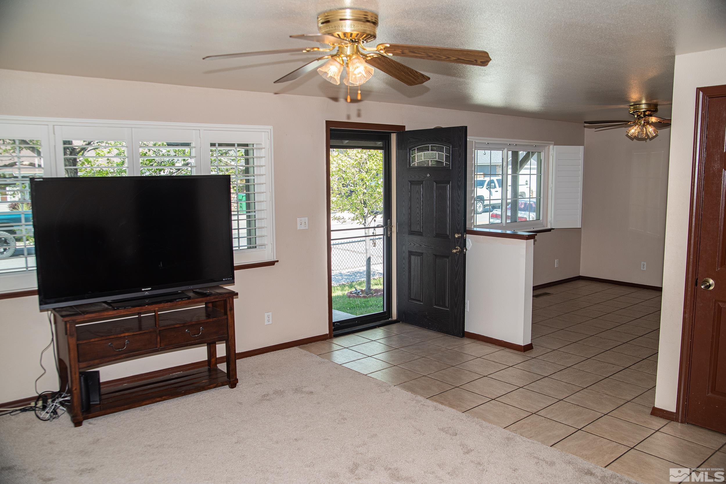 2525 Ridgecrest Drive Carson City, NV 89706 - Photo 5 of 21 a living room with furniture and a flat screen tv