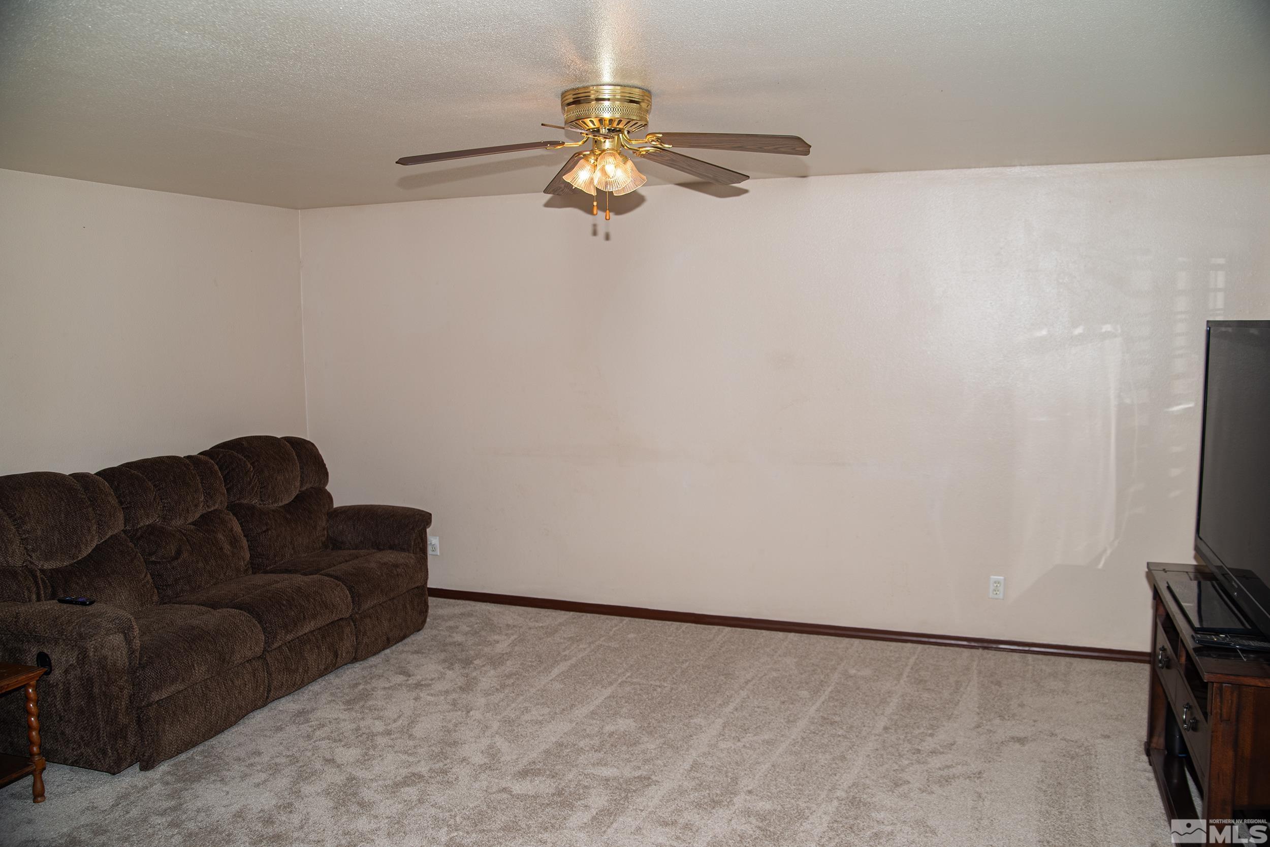 2525 Ridgecrest Drive Carson City, NV 89706 - Photo 6 of 21 a living room with furniture and a flat screen tv